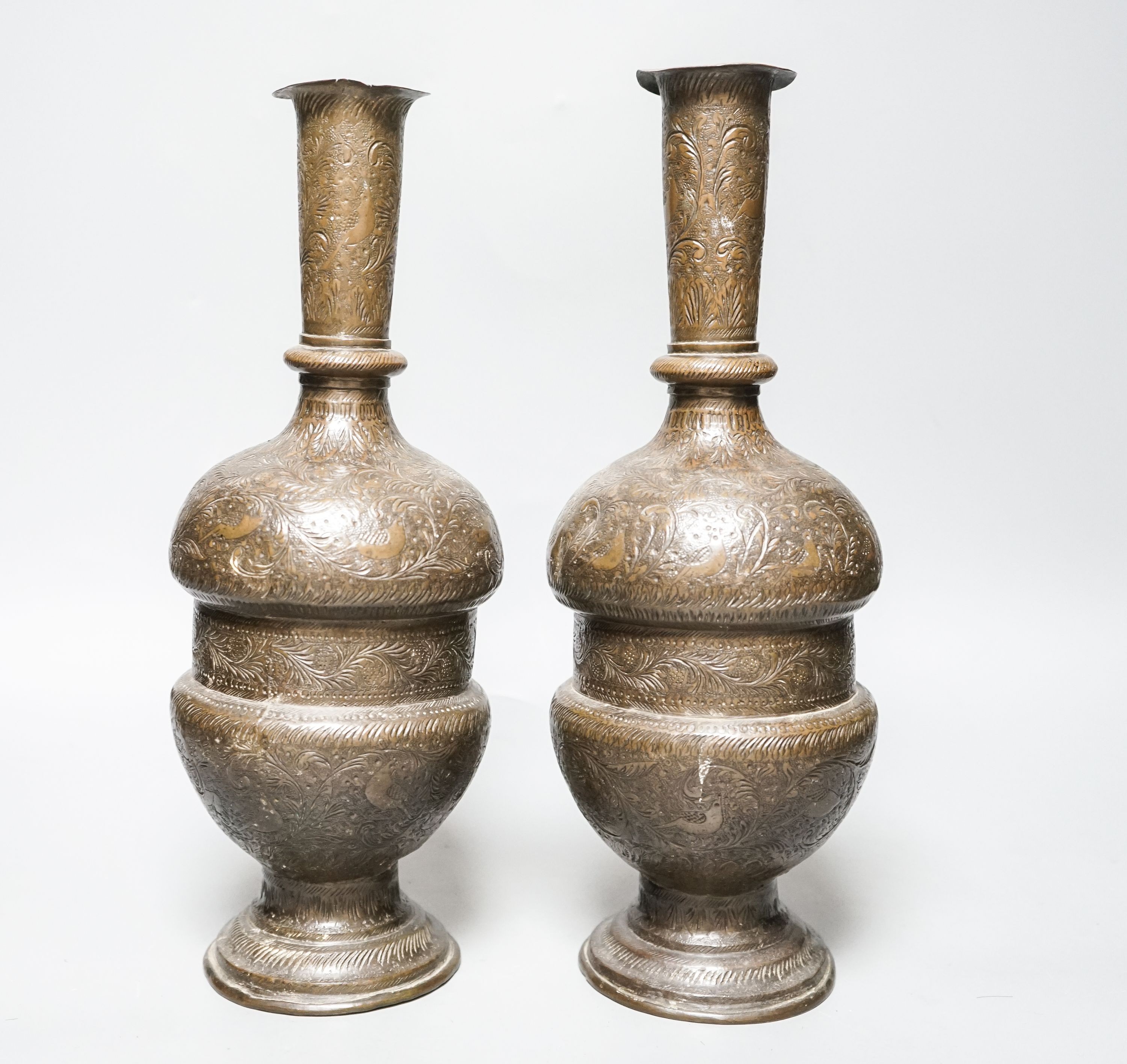 A pair of Persian engraved vases 32cm